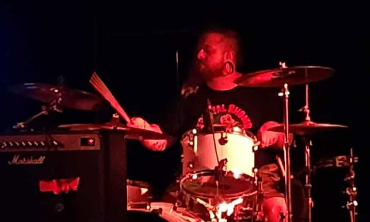 Lobey playing drums on stage